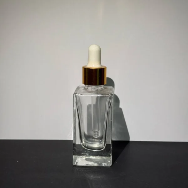 بطری شیشه‌ای ۳۰ میل شفاف با قطره چکان مناسب برای اسانس، روغن و سرم پوست