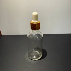بطری شیشه‌ای شفاف همراه با قطره چکان مناسب برای اسانس و سرم‌های مراقبتی
