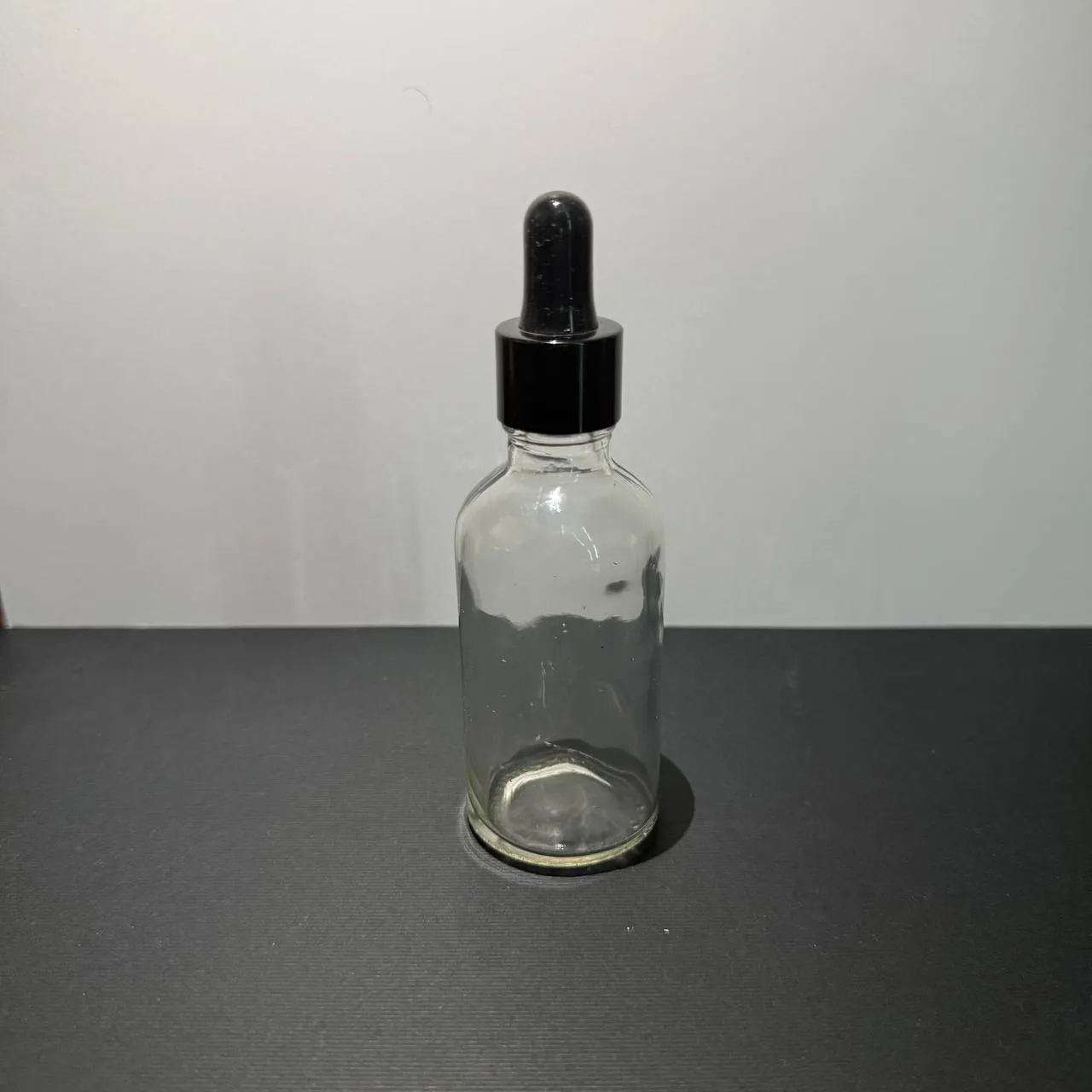 photo_۲۰۲۵-۰۵-۱۸_۱۱-۰۲-۳۷ شيشه شفاف 50 میل همراه با قطره چكان مشکی